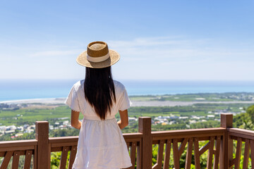 Wall Mural - Woman enjoy the scenery sea view