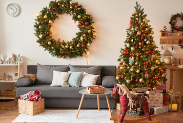 living room interior. christmas tree and wreath. new year celebration. vacation rentals. winter holi