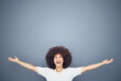 Happy black woman with arms open on studio background mockup and advertising or product placement. Smile on face, welcome and fun, afro woman exited for announcement or small business discount sale.