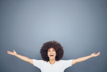 Happy black woman with arms open on studio background mockup and advertising or product placement. Smile on face, welcome and fun, afro woman exited for announcement or small business discount sale.