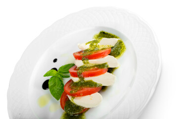 Poster - Close-up of tasty fresh salad in white plate isolated on white background