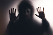 © erika8213 - Shadowy figure behind glass - horror background