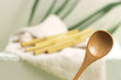Eco bamboo spoon on green background. Concept, natural material organic cutlery, zero waste, eco-friendly