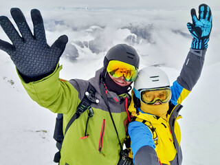 Poster - couple skier and snowboarder taking selfie at the mountain top