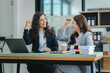 © Daenin - young women working together hands together teamwork Smiling happy and excited at her work.