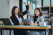 © Daenin - young women working together hands together teamwork Smiling happy and excited at her work.