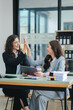 © Daenin - young women working together hands together teamwork Smiling happy and excited at her work.