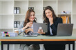 © Daenin - girl working together offer ideas to each other.happy young business colleagues working in the office