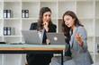 © Daenin - girl working together offer ideas to each other.happy young business colleagues working in the office