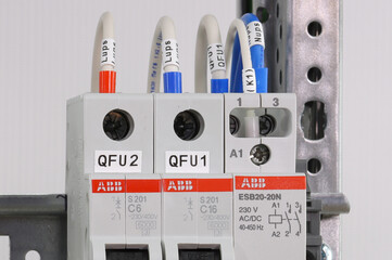 Marking modules and wires with labels in electrical panels.Soft focus.