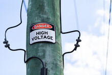 Danger Warning High Voltage Sign On Power Pole