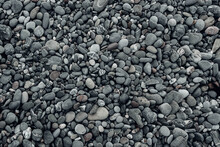 Abstract Background With Black And Gray Round Sea Pebble Stones