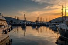 Moored Yachts And Motorboats At Sunset