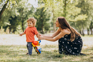 Wall Mural - Mother with her little son together in park