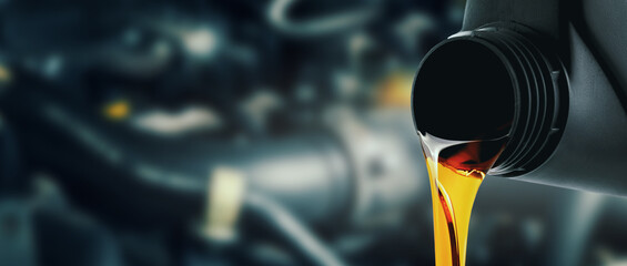 change and pour new car engine oil into the motor. banner with copy space