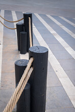 Wooden Barrier Posts With Thick Ropes