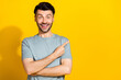 © deagreez - Photo of overjoyed man khaki stylish clothes arm direct empty space recommendation positive feedback isolated on yellow color background