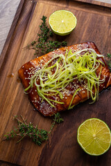 Poster - salmon steak in grilled sauce on a wooden board