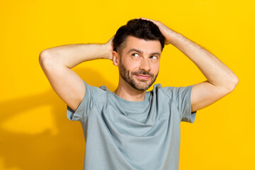 Sticker - Portrait photo of young positive dreamy brutal bearded man touching gel his hairdo looking empty space advertisement isolated on yellow color background