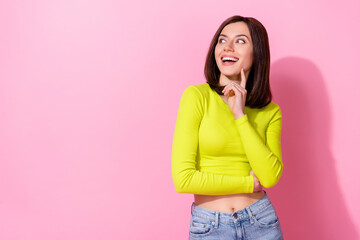 Wall Mural - portrait of adorable lovely lady finger touch chin look interested empty space isolated on pink colo
