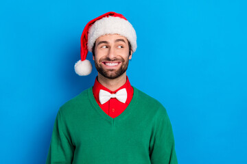 Wall Mural - Photo of cheerful funky guy beaming smile look interested empty space isolated on blue color background