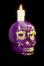 3d Illustration Purple Skull With Yellow Details With Candle On Black Background