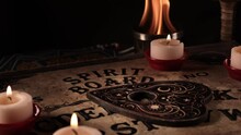 The Spiritual Witchcraft Ouija Board In Candle Light 