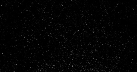 Wall Mural - Cinematic snow storm with hard wind on black background in slow motion. Weather atmosphere overlay filmed with RED camera