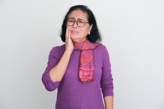 Elderly Asian women suffering toothache