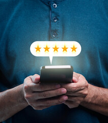 Satisfaction survey and Customer service concept. Businessman or Business people are touching a virtual screen on happy Smiley face icon symbol to give satisfaction in service. rating very impressed.