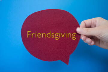 Poster - Speech bubble in front of colored background with Friendsgiving text.