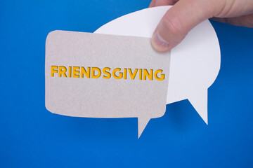 Poster - Speech bubble in front of colored background with Friendsgiving text.