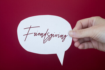 Poster - Speech bubble in front of colored background with Friendsgiving text.