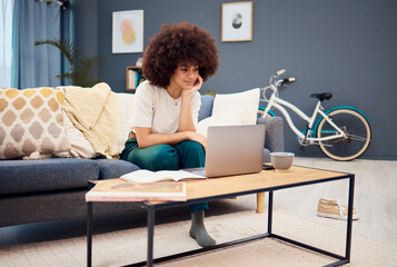 Aufkleber - Laptop, education and learning with a black woman student watching an online video while studying in a living room. Computer, study and homework with a female university or college pupil in her home