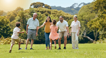 Wall Mural - Big family, nature park and happy to play with children running on grass with senior grandparents, mom and dad smile in summer sunshine. Fun mother, father and open arms to hug kids outdoors together