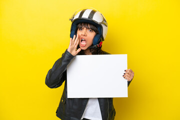 Wall Mural - Young latin woman with a motorcycle helmet isolated on yellow background holding an empty placard and shouting