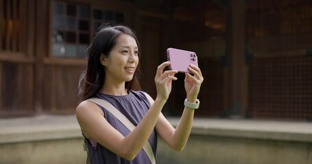 Sticker - Travel woman use mobile phone to take photo at Japanese temple