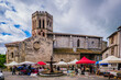 View on the Saint Lizier romanesque cathedral on market day in the South of France (Ariege)