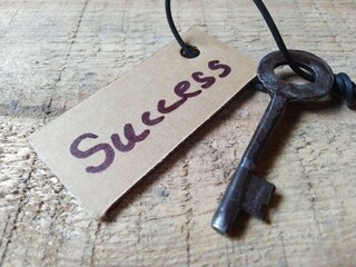 Concept image of success on a wooden background