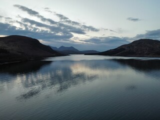 Sticker - Beautiful shot of a seascape with hills in the evening