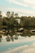 Vertical Of The Landscape Reflected In Lake Natoma In Folsom, California