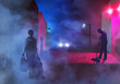 A runaway teen aged girl with luggage in tow walks through a dark and foggy town late at night in a 3-d illustration about teens who run away from home.