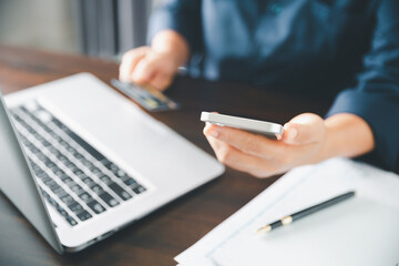 Woman hands of using online virtual app on mobile phone. Millennial guy chatting on smartphone, using banking services, reading text message, typing, shopping, making call, browsing internet.Close up