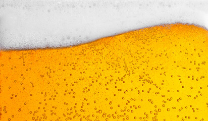 Wall Mural - pouring beer with bubbles for background and wave shape texture foam