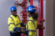 © amorn - Two engineer or technician maintenance, checking, or test system springer prevent fire. Group of African American contractor checking fire sprinkler system, pipe assembly, red fire pipe
