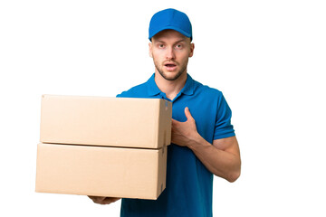 Wall Mural - Delivery caucasian man over isolated background surprised and shocked while looking right