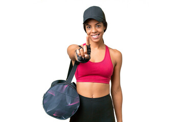 Wall Mural - Young sport African american woman with sport bag over isolated background showing and lifting a finger