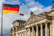 The Reichstag building with German flags, Berlin, Germany