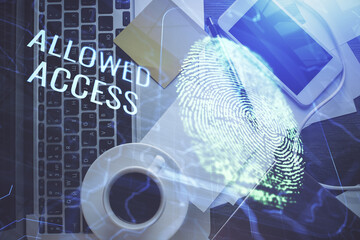 Poster - Finger print over computer on the desktop background. Top view. Double exposure. Concept of securitization.