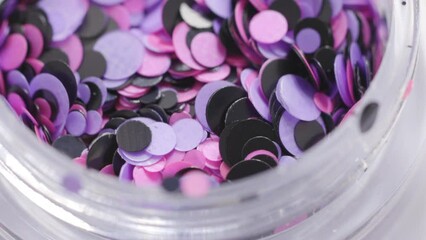 Poster - pink sequins in a jar rotate in a circle